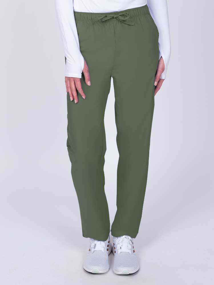 Young woman wearing a Luv Scrubs by MedWorks Women's Elastic Waist Cargo Pant in olive featuring one cargo pocket on the wearer's left side.