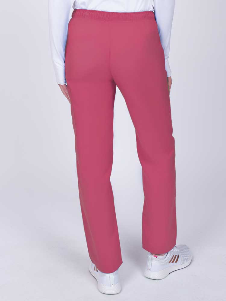 Nurse wearing a Luv Scrubs by MedWorks Women's Elastic Waist Cargo Pant in shocking pink with an elastic and drawstring waist.