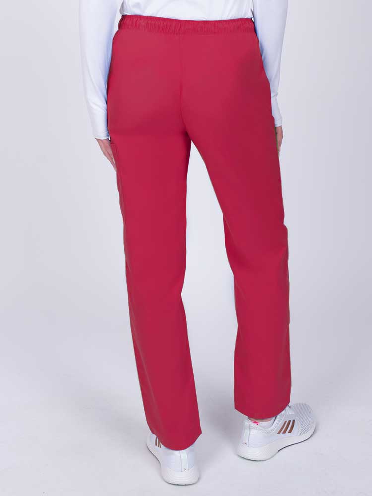 Nurse wearing a Luv Scrubs by MedWorks Women's Elastic Waist Cargo Pant in red with an elastic and drawstring waist.