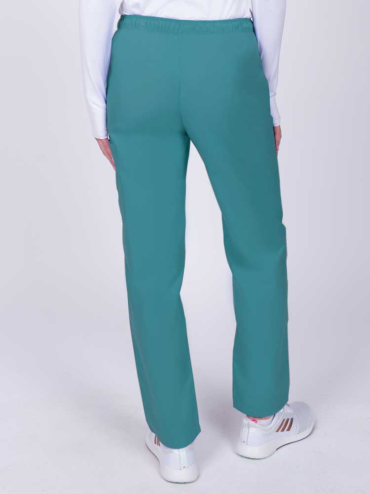 Nurse wearing a Luv Scrubs by MedWorks Women's Elastic Waist Cargo Pant in teal with an elastic and drawstring waist.