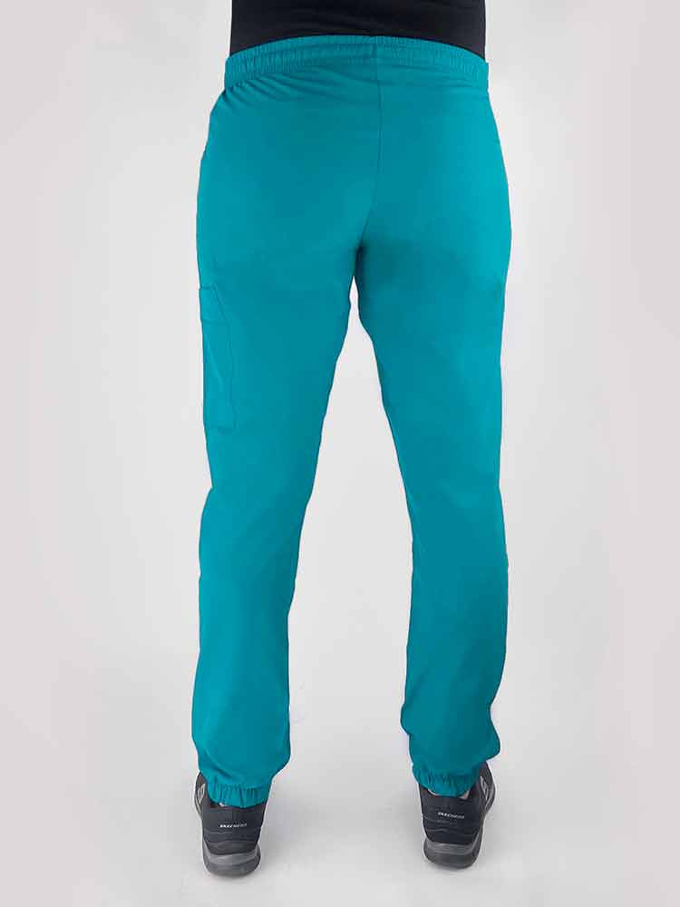 Young woman wearing a Luv Scrubs by MedWorks Women's Scrub Jogger in teal with an elastic, drawstring waist.
