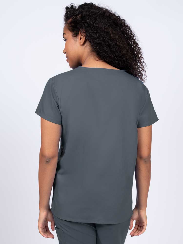 Woman wearing a Luv Scrubs by MedWorks Women's V-neck Scrub Top in pewter with a center back length of 26".