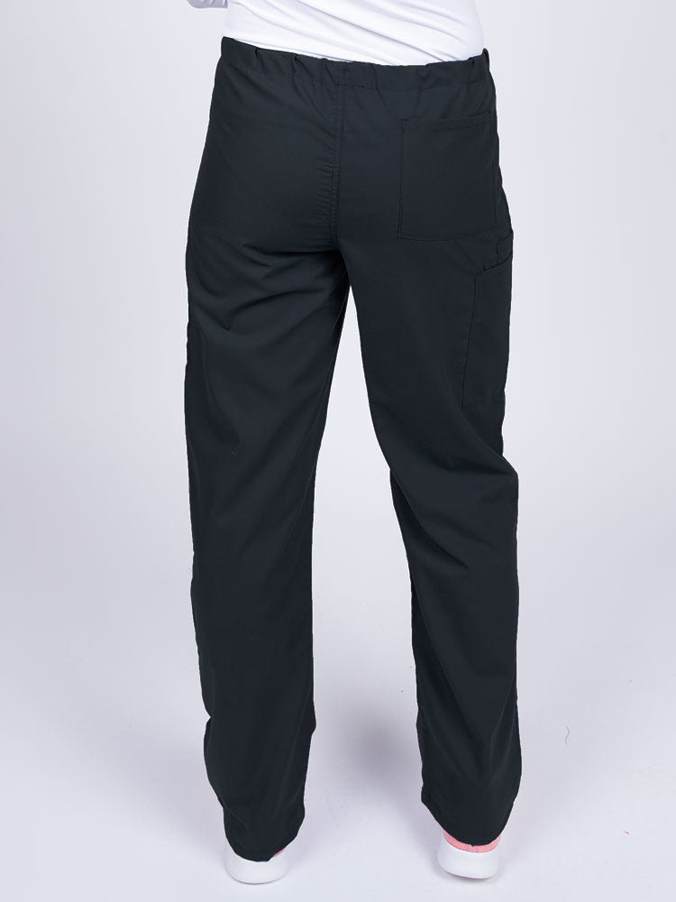 Woman wearing a Luv Scrubs Unisex Drawstring Cargo Pant in black with one back pocket on the wearer's right side.
