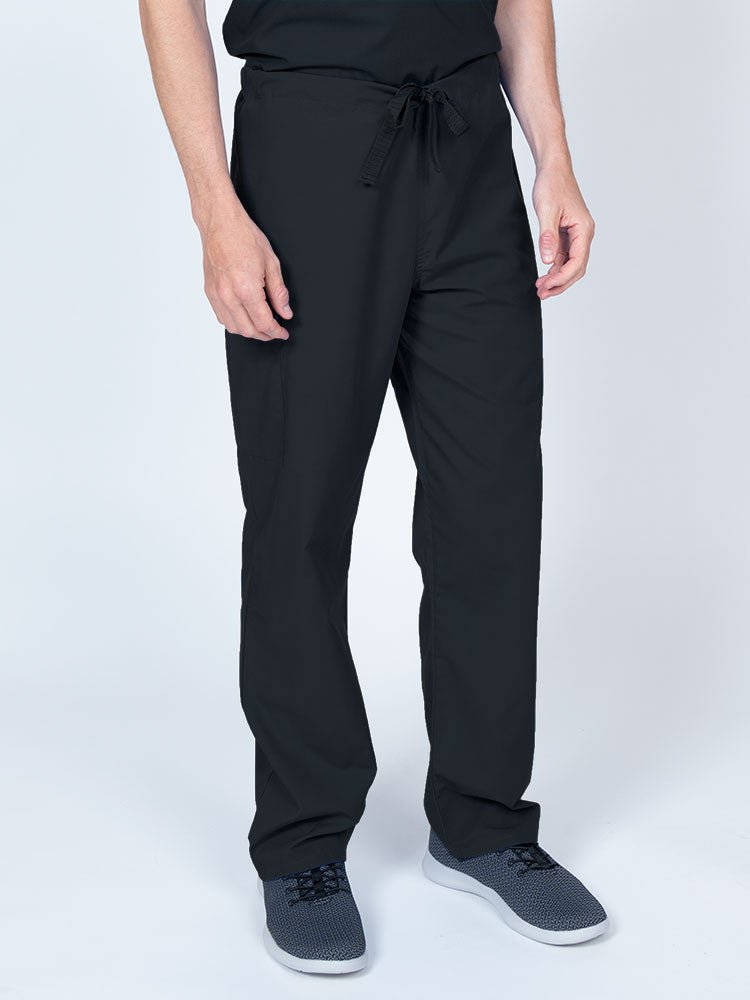 Man wearing a Luv Scrubs Unisex Drawstring Cargo Pant in black with an inseam of 31".