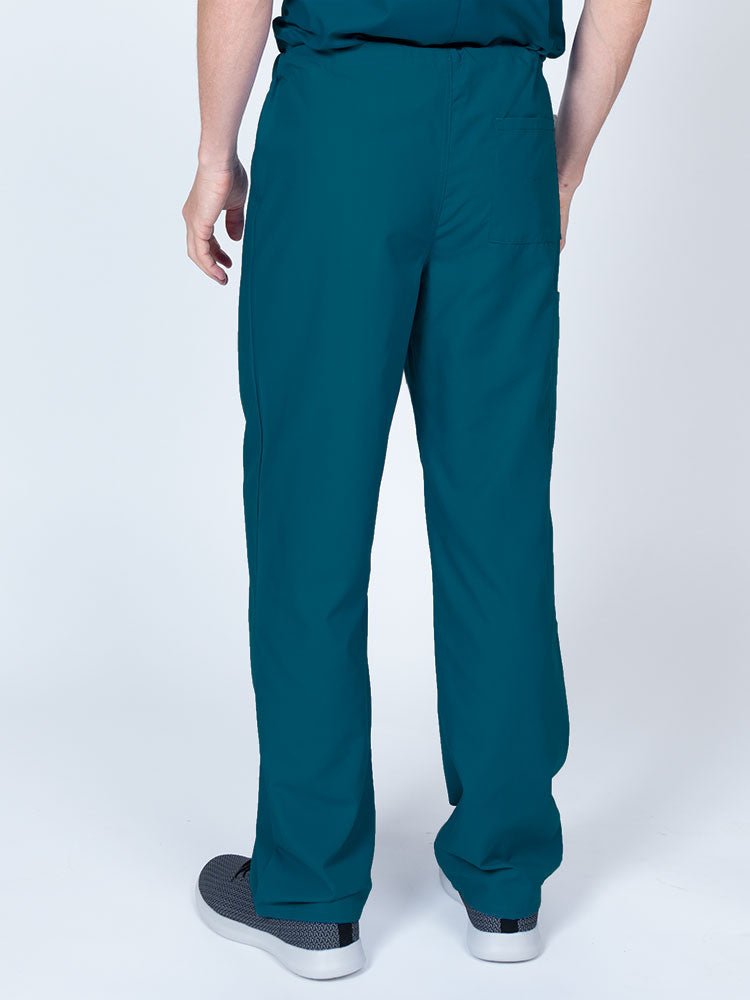 Male nurse wearing a Luv Scrubs Unisex Drawstring Cargo Pant in Caribbean featuring a lightweight, breathable fabric.