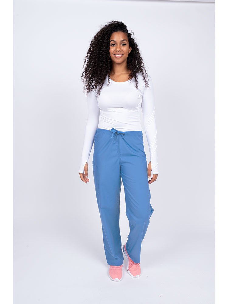 Young nurse wearing a Luv Scrubs Unisex Drawstring Cargo Pant in ceil with drawstring waist.