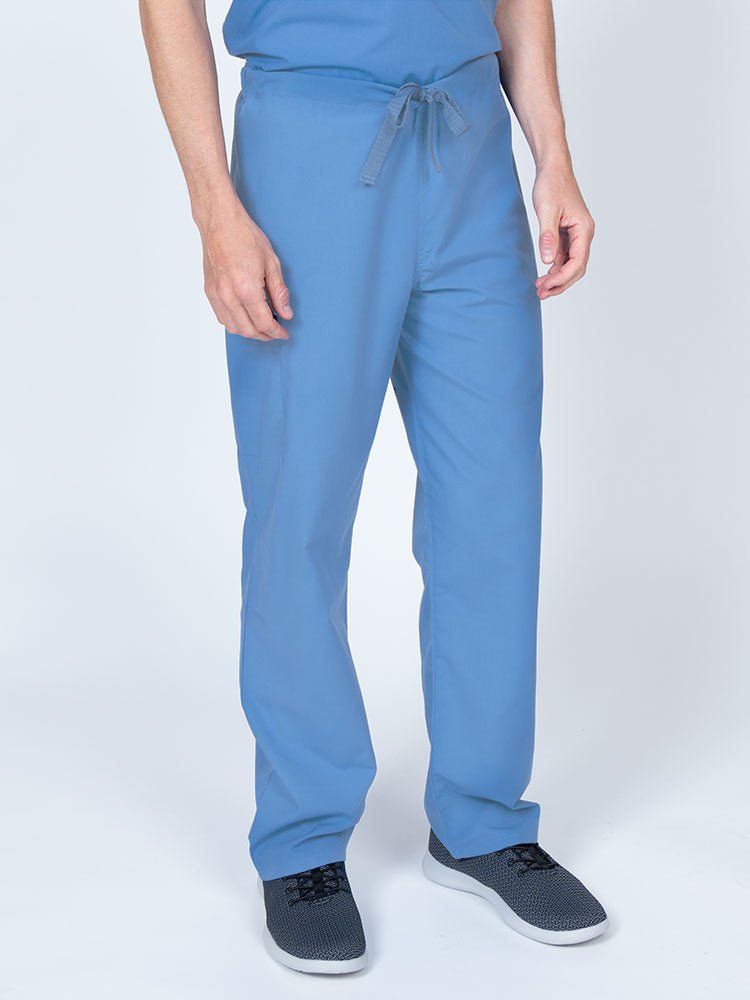 Man wearing a Luv Scrubs Unisex Drawstring Cargo Pant in ceil  with an inseam of 31".