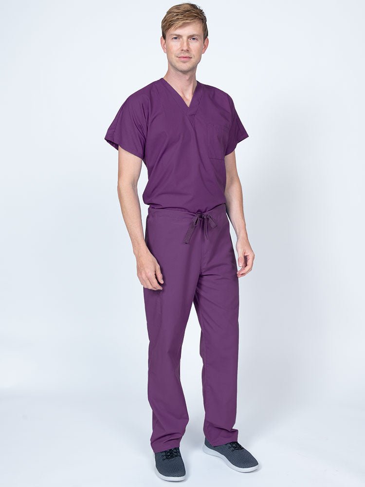 Man wearing a Luv Scrubs Drawstring Cargo Pant in eggplant featuring a unisex fit.