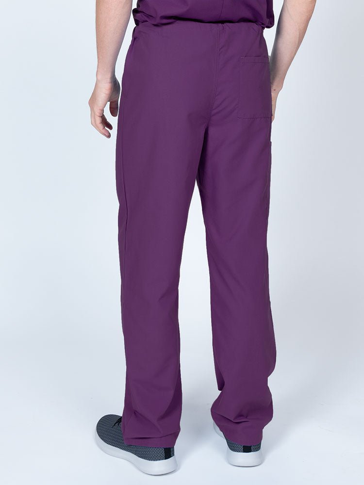Male nurse wearing a Luv Scrubs Unisex Drawstring Cargo Pant in eggplant featuring a lightweight, breathable fabric.