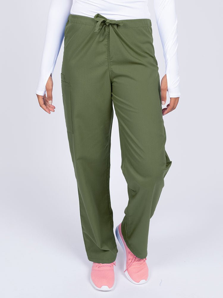 Young nurse wearing a Luv Scrubs Unisex Drawstring Cargo Pant in olive with a total of 3 pockets.