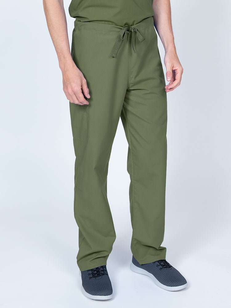 Man wearing a Luv Scrubs Unisex Drawstring Cargo Pant in olive with an inseam of 31".