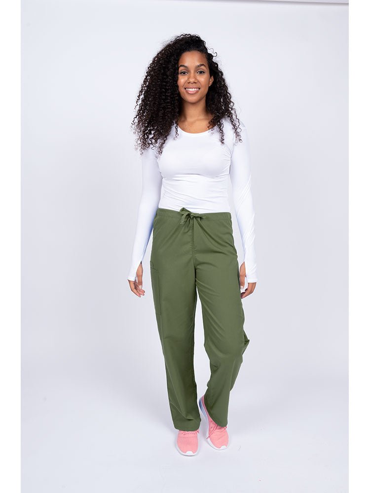 Young nurse wearing a Luv Scrubs Unisex Drawstring Cargo Pant in olive with drawstring waist.