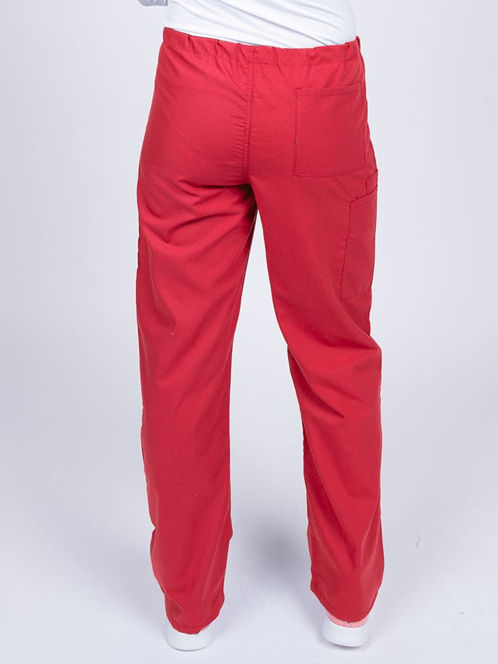 A young female LPN wearing a Luv Scrubs Unisex Drawstring Cargo Pant in Red with one back pocket on the wearer's right side.