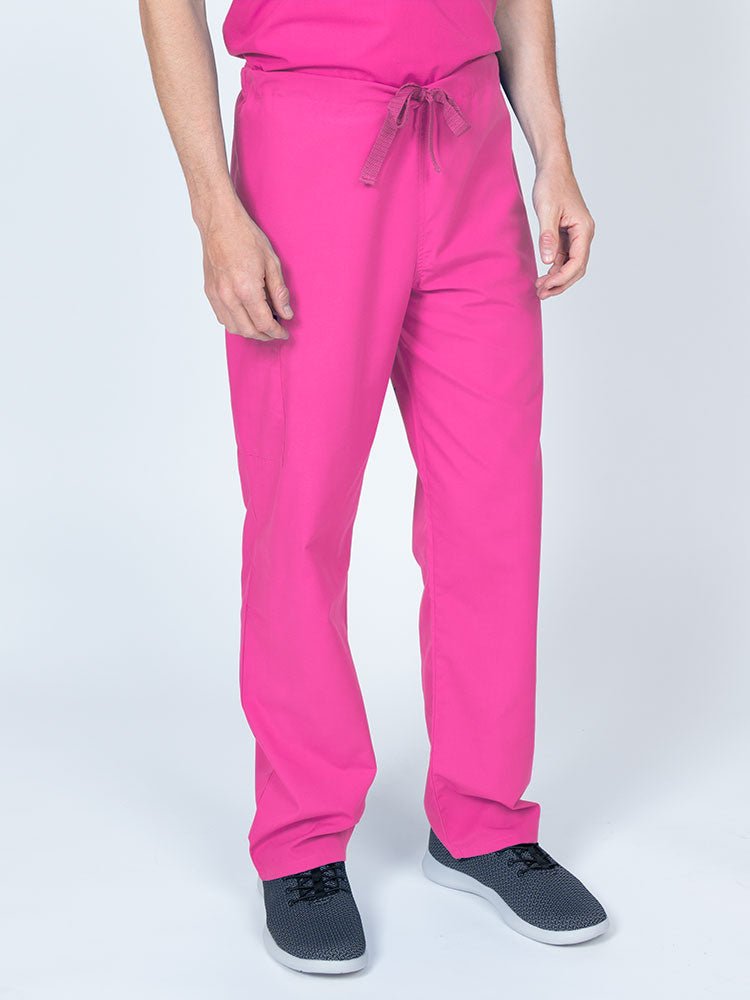 Man wearing a Luv Scrubs Unisex Drawstring Cargo Pant in shocking pink with an inseam of 31".