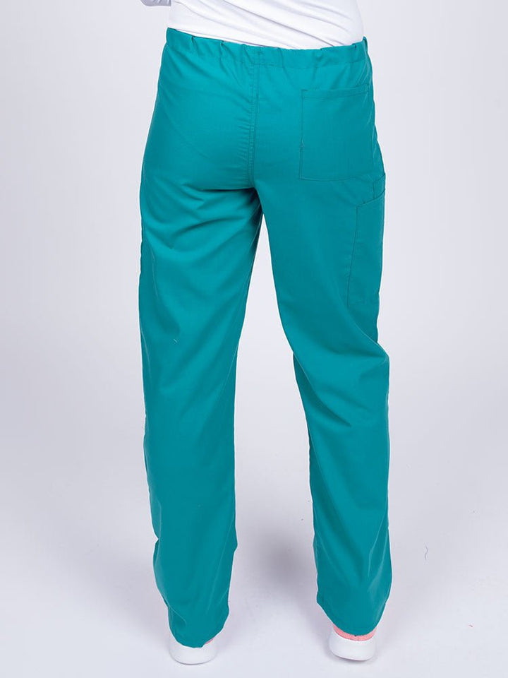 Woman wearing a Luv Scrubs Unisex Drawstring Cargo Pant in teal with one back pocket on the wearer's right side.