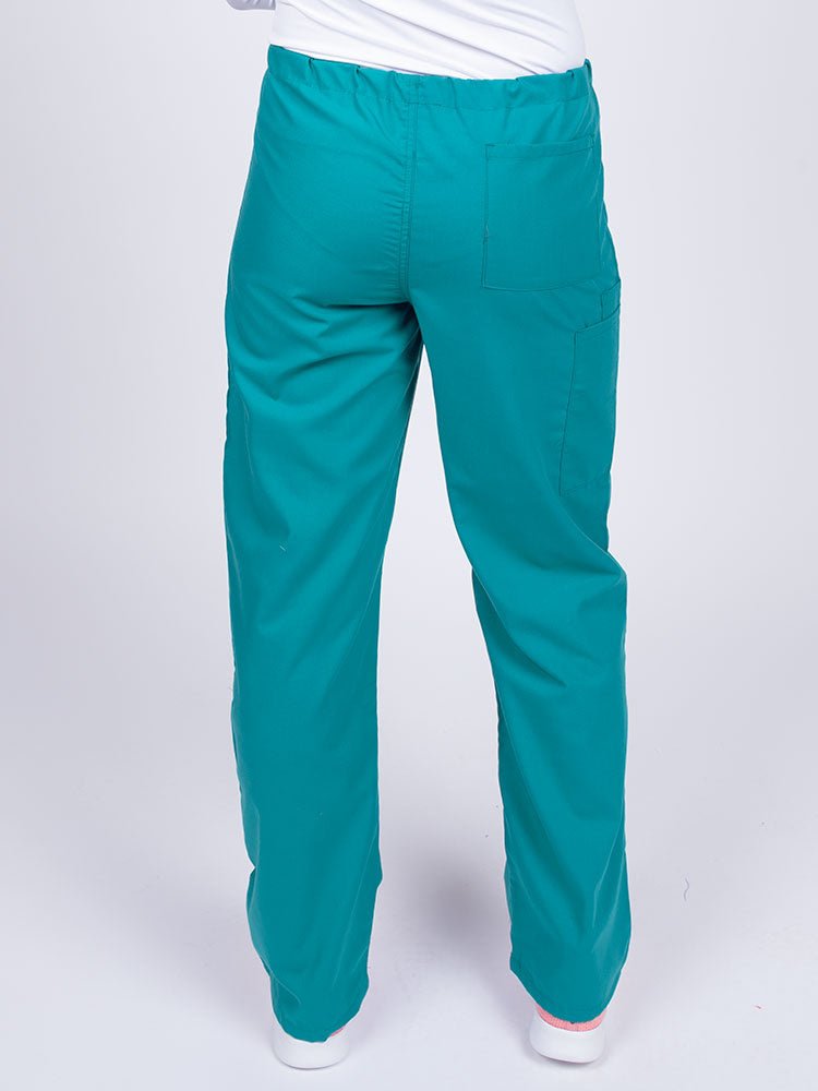 Woman wearing a Luv Scrubs Unisex Drawstring Cargo Pant in teal with one back pocket on the wearer's right side.