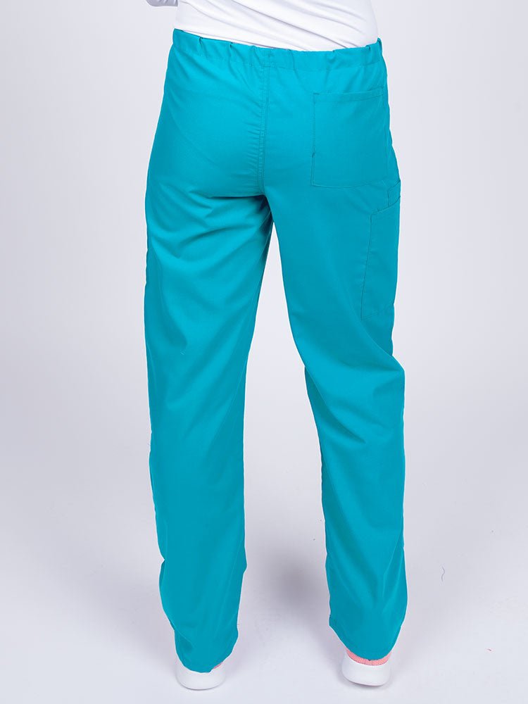 Woman wearing a Luv Scrubs Unisex Drawstring Cargo Pant in turquoise with one back pocket on the wearer's right side.
