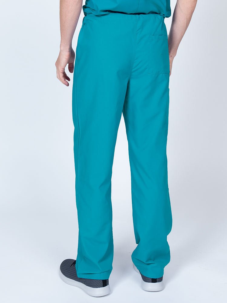 Male nurse wearing a Luv Scrubs Unisex Drawstring Cargo Pant in turquoise featuring a lightweight, breathable fabric.