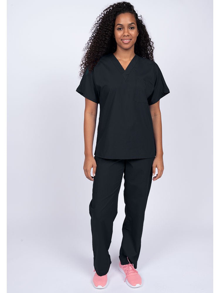 A young female Physical Therapist wearing a Luv Scrubs Unisex Single Pocket Scrub Top in Black featuring a V-neckline.