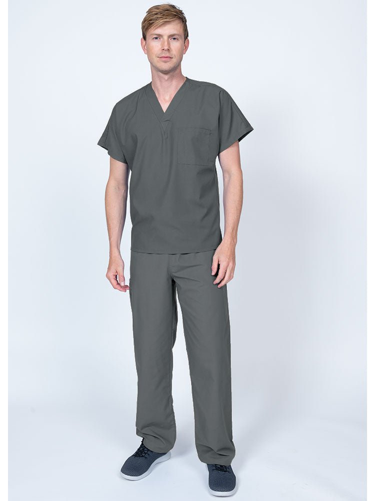 Young man wearing a Luv Scrubs Single Pocket V-Neck Scrub Top in pewter featuring a unisex fit.