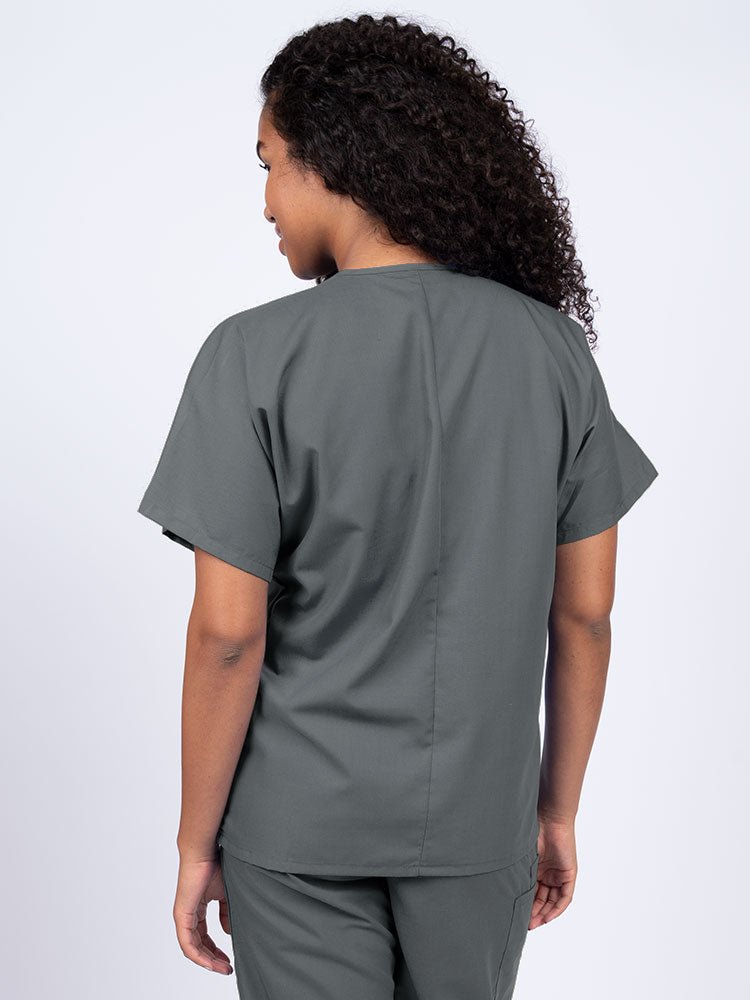 Nurse wearing a Luv Scrubs Unisex Single Pocket V-Neck Scrub Top in pewter with a center back length of 27.5".