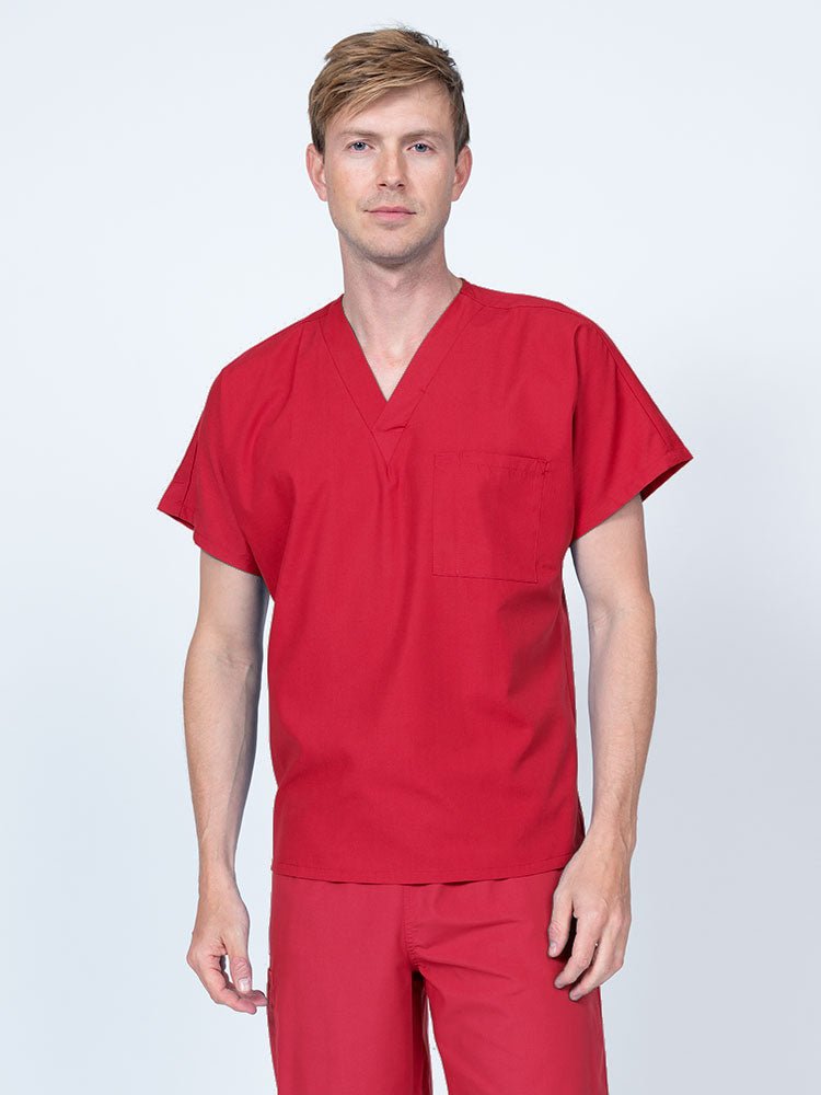 Man wearing a Luv Scrubs Unisex Single Pocket V-Neck Scrub Top in red with dolman sleeves and 1 chest pocket.
