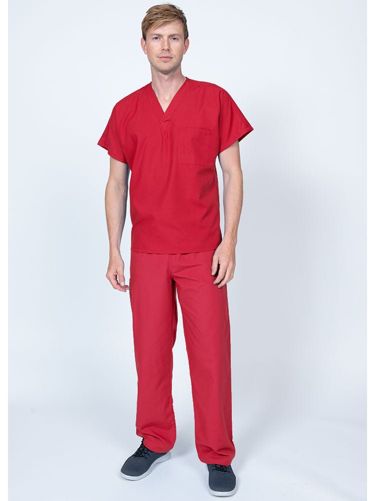 Young man wearing a Luv Scrubs Single Pocket V-Neck Scrub Top in red featuring a unisex fit.
