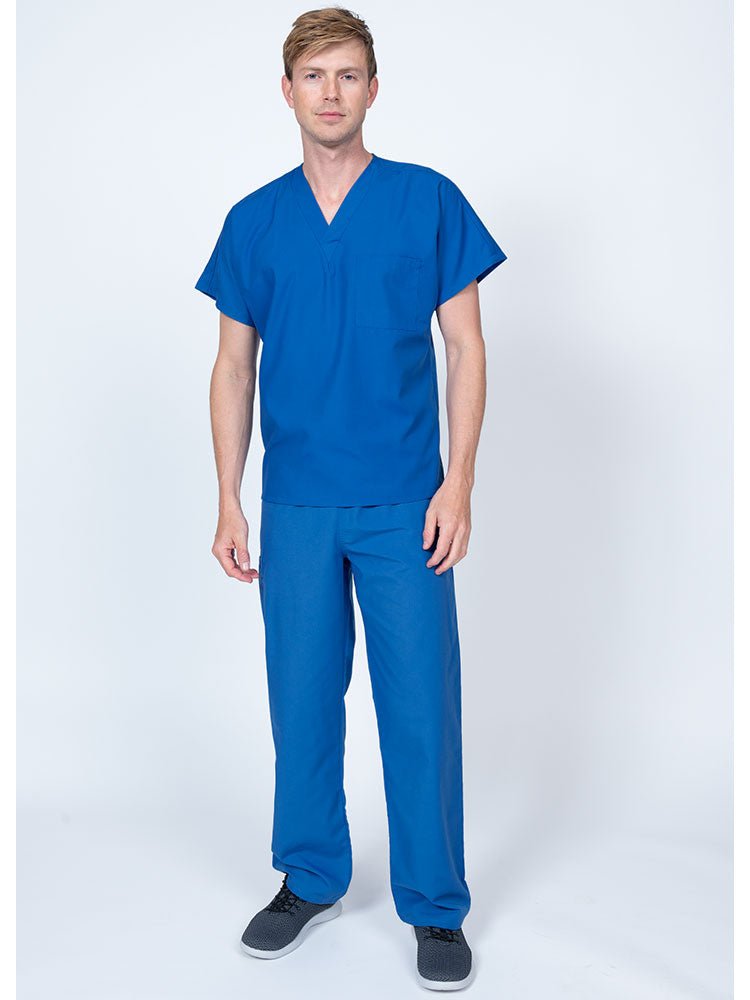 Young man wearing a Luv Scrubs Single Pocket V-Neck Scrub Top in royal featuring a unisex fit.