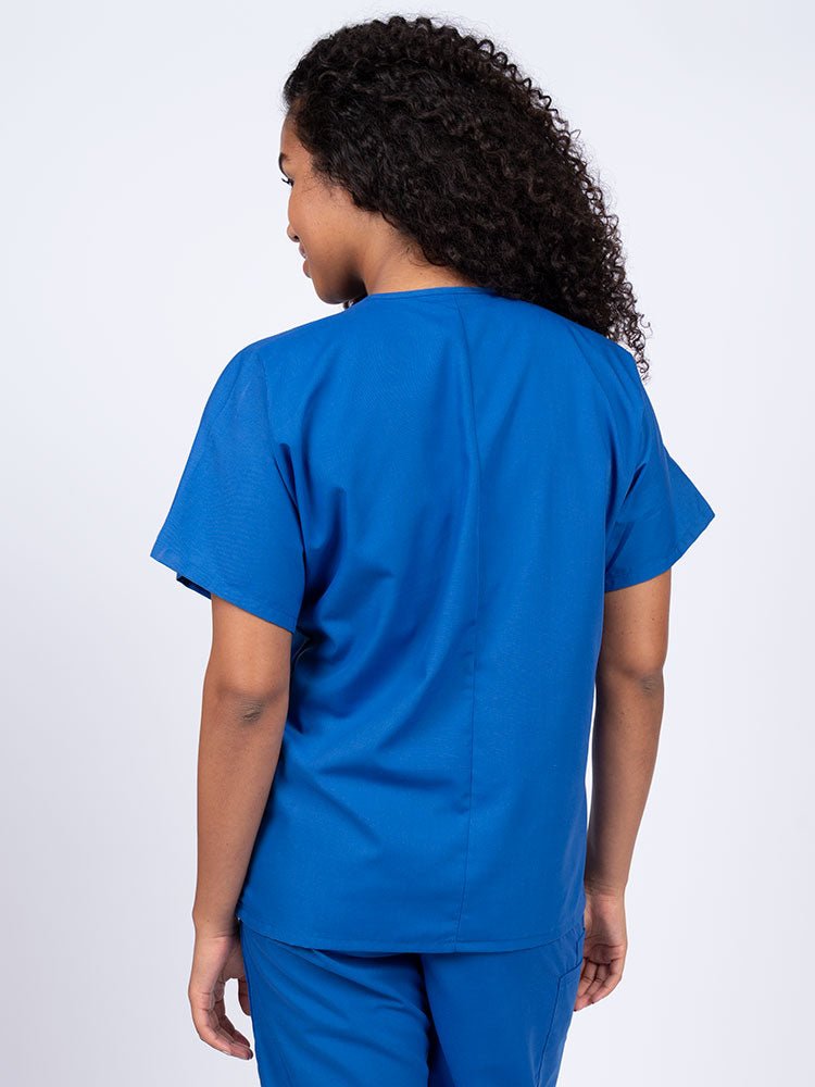 Nurse wearing a Luv Scrubs Unisex Single Pocket V-Neck Scrub Top in royal with a center back length of 27.5".