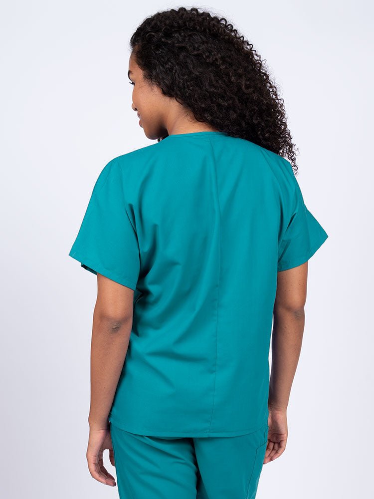 Nurse wearing a Luv Scrubs Unisex Single Pocket V-Neck Scrub Top in teal with a center back length of 27.5".