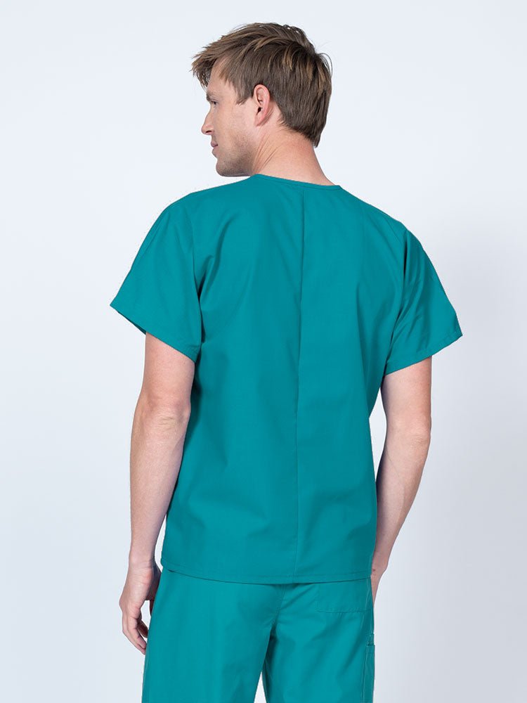 Male nurse wearing a Luv Scrubs Unisex Single Pocket V-Neck Scrub Top in teal with a lightweight, breathable fabric made of 55% Cotton and 45% Polyester.