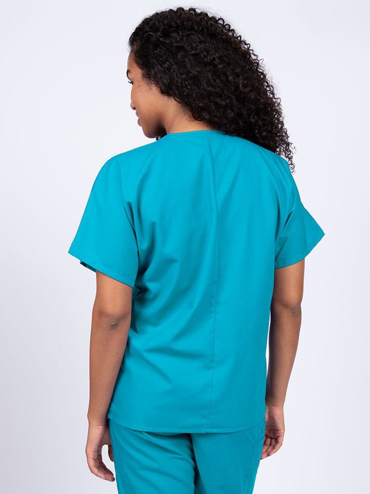 Nurse wearing a Luv Scrubs Unisex Single Pocket V-Neck Scrub Top in turquoise with a center back length of 27.5".