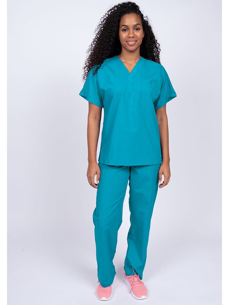 Young woman wearing a Luv Scrubs Unisex Single Pocket Scrub Top in turquoise featuring a V-neckline.