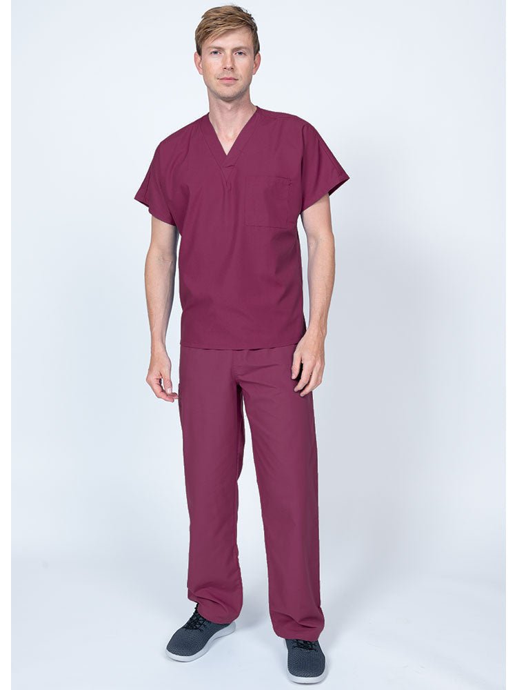 Young man wearing a Luv Scrubs Single Pocket V-Neck Scrub Top in wine featuring a unisex fit.