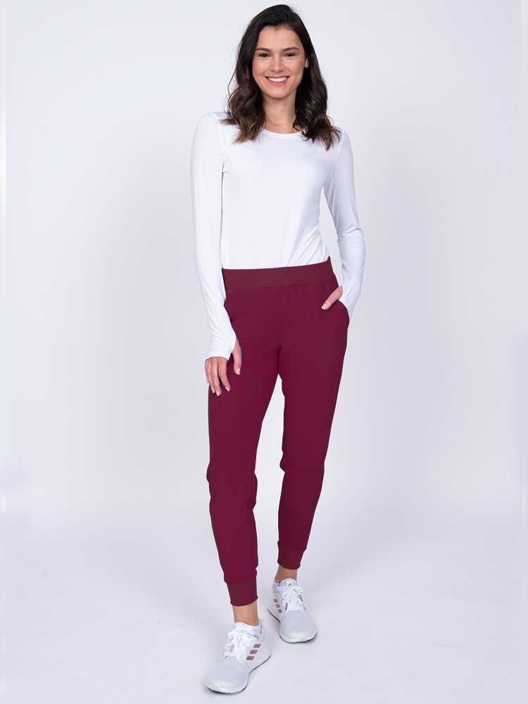 Meraki Sport Women's Jogger Scrub Pant in wine featuring comfortable lightweight fabric