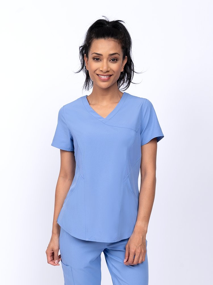 Meraki Sport Women's Mock Wrap Scrub Top in ceil featuring front princess seams to provide a flattering fit