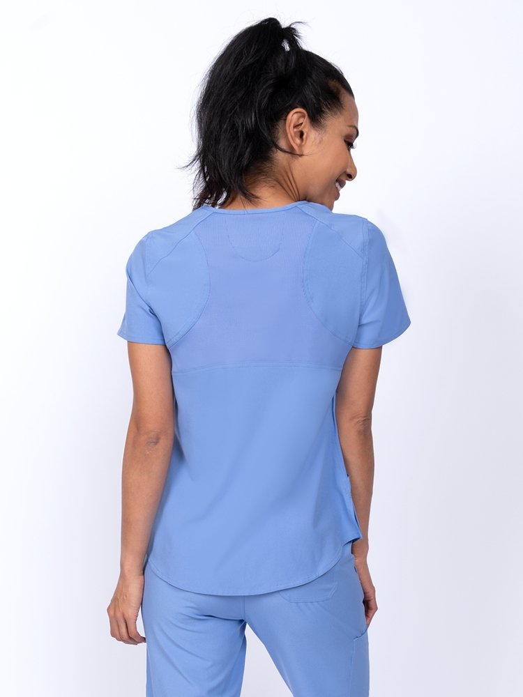 Meraki Sport Women's Mock Wrap Scrub Top in ceil featuring 4-way stretch fabric for a flexible fit 