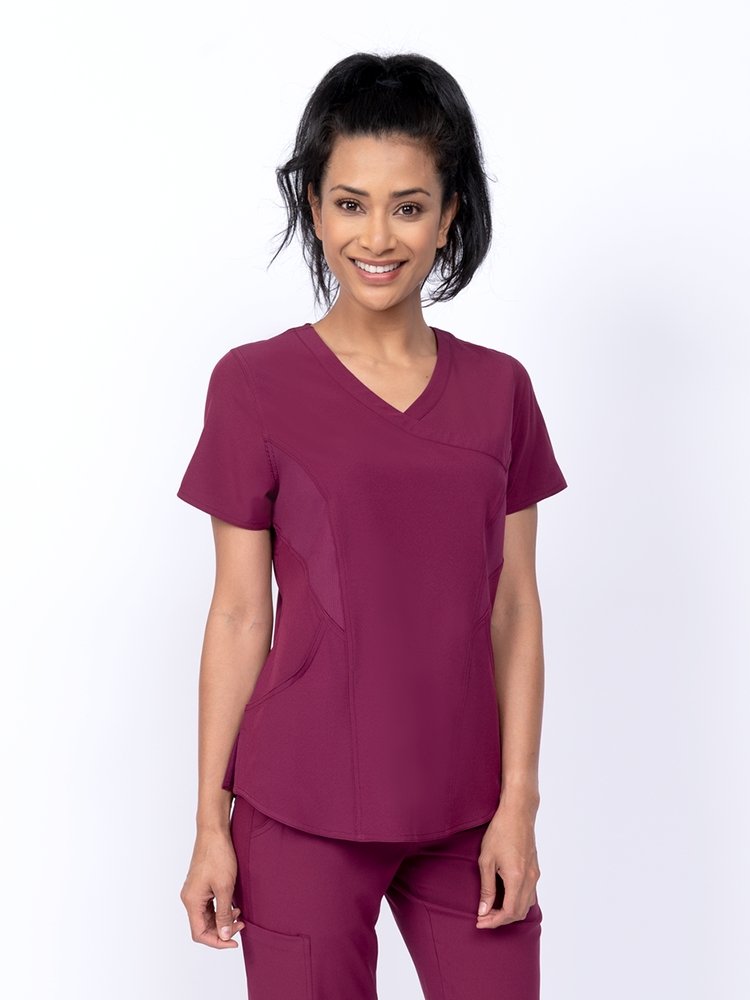 Meraki Sport Women's Mock Wrap Scrub Top in wine featuring front princess seams to provide a flattering fit