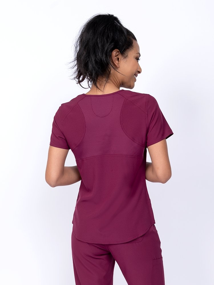 Meraki Sport Women's Mock Wrap Scrub Top in wine featuring 4-way stretch fabric for a flexible fit 