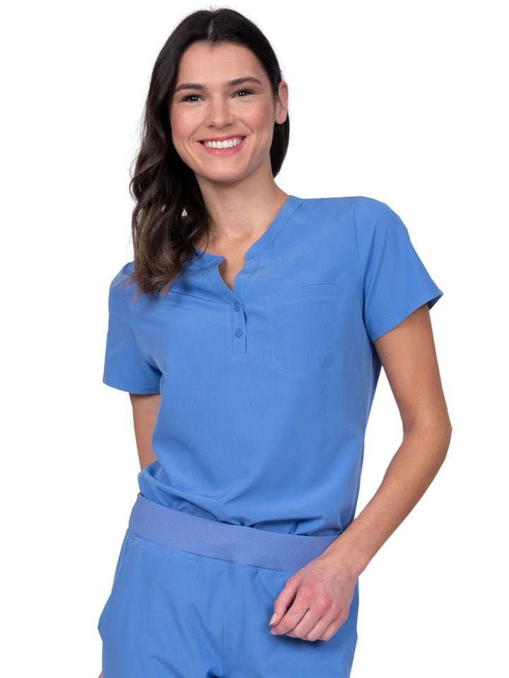 Meraki Sport Women’s Tuck-In Scrub Top in ceil featuring a Henley neckline with 2-button placket