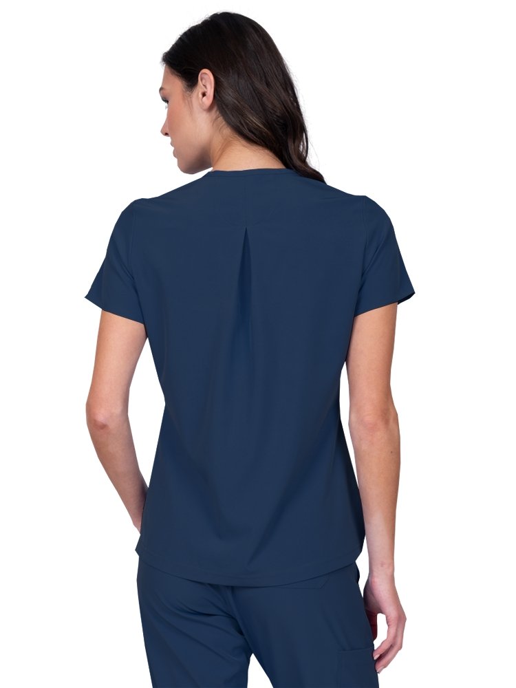 Meraki Sport Women’s Tuck-In Scrub Top in navy featuring  a slight high low curved hemline