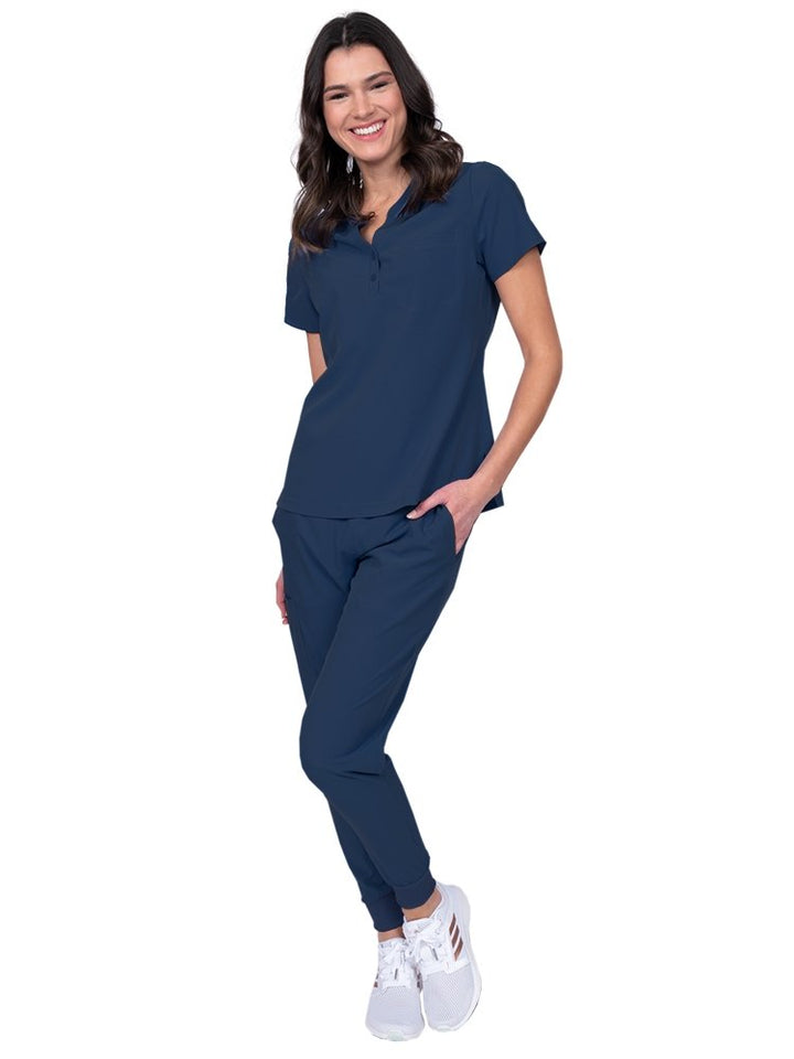 Meraki Sport Women’s Tuck-In Scrub Top in navy featuring a contemporary fit with round neckline