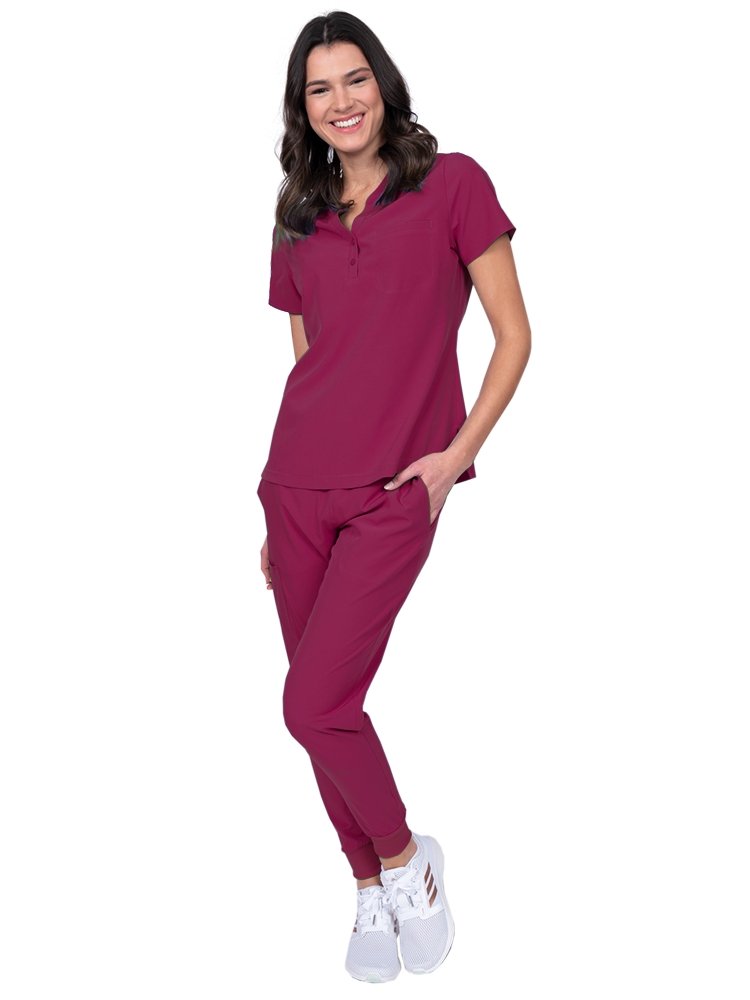 Meraki Sport Women’s Tuck-In Scrub Top in wine featuring a contemporary fit with round neckline