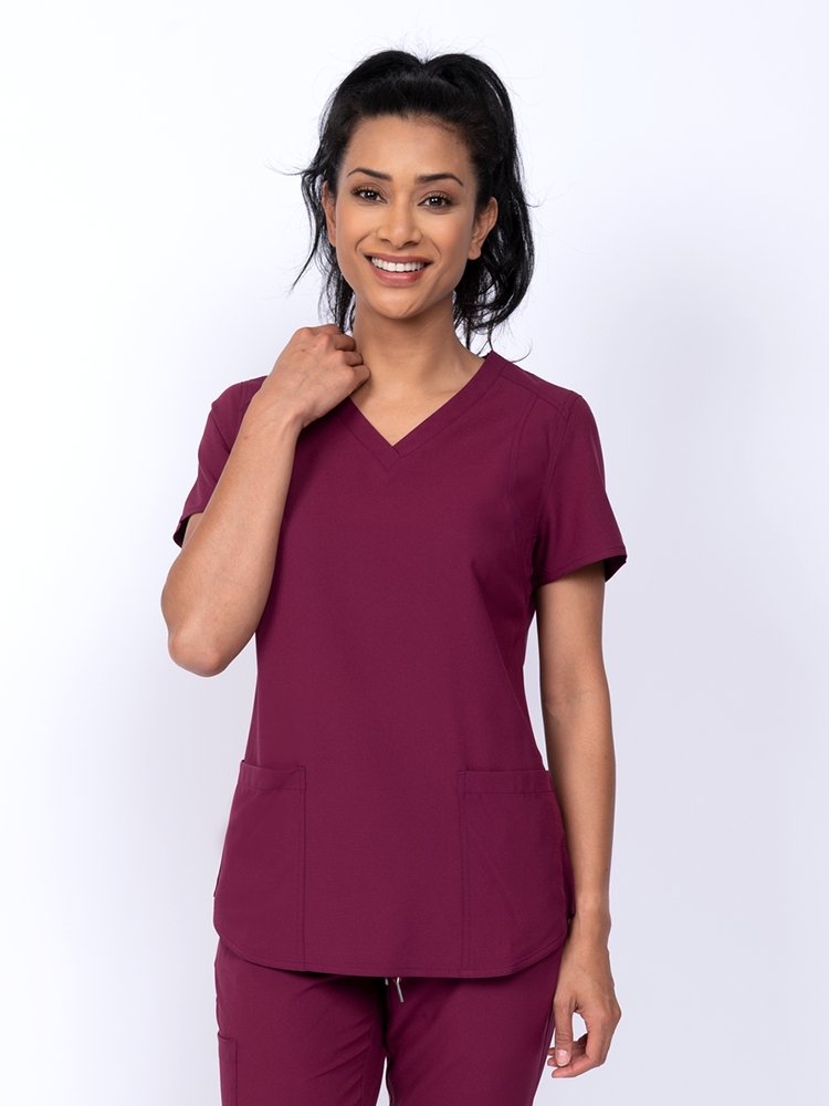 Meraki Sport Women's V-Neck Scrub Top in wine featuring 4-way stretch fabric for added mobility