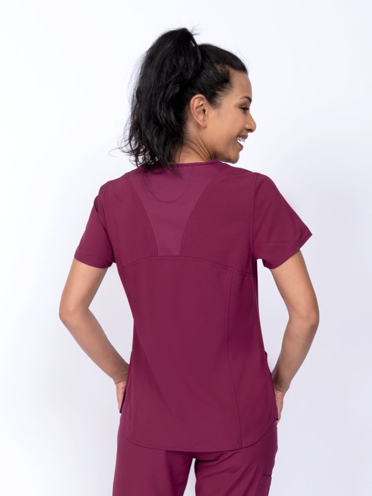 Meraki Sport Women's V-Neck Scrub Top in wine featuring  back princess seams