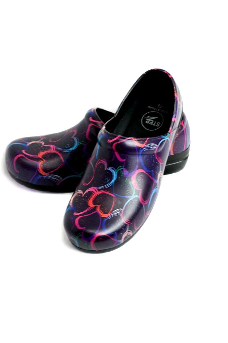 A view of the bottom & front of the StepZ Women's Slip Resistant Memory Foam Clog in "Plum Brush Stroke Hearts" size 7 featuring a classic slip-on style & a heel height of roughly 1.5".