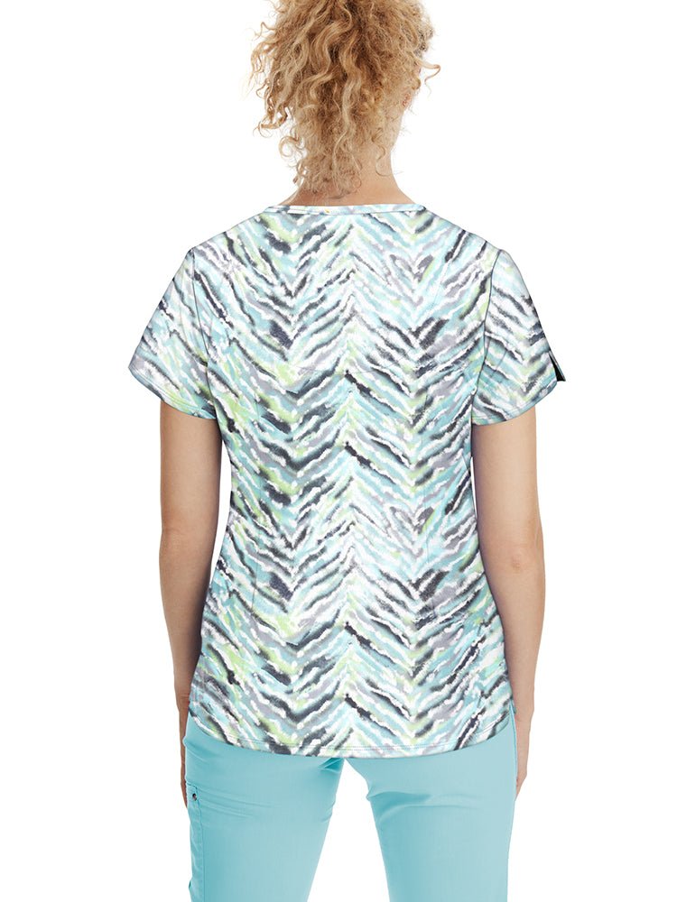Female healthcare worker wearing a Healing Hands Women's Isabel Print Top in "Nature's Art" featuring a Y-neck with decorative buttons.