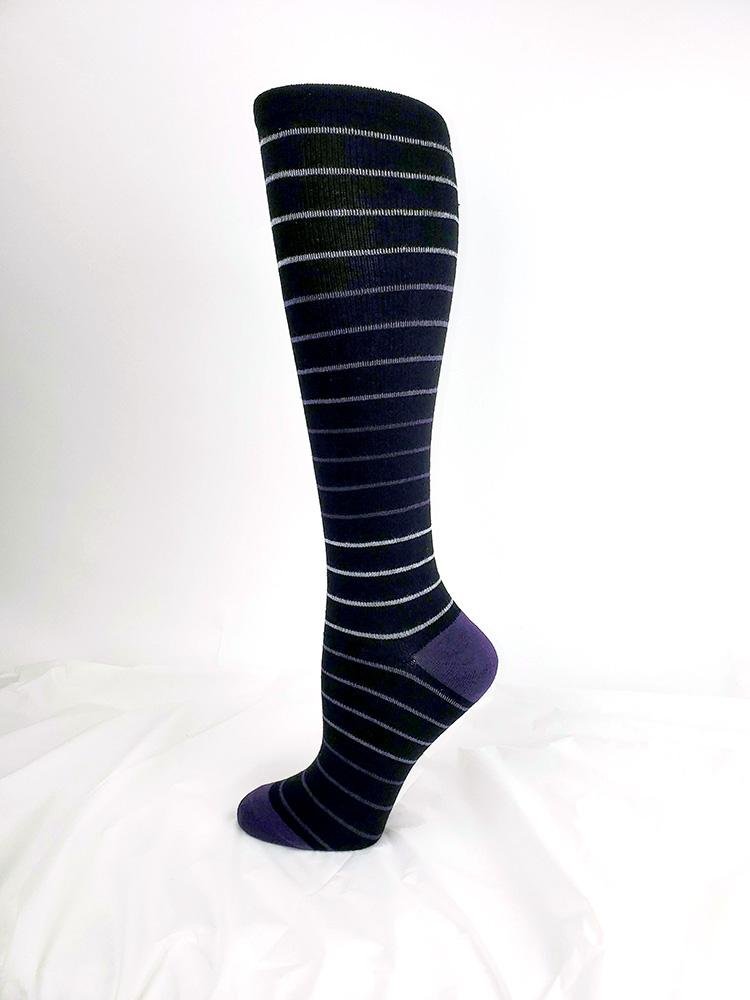 Foot mannequin displaying Pro-Motion Women's Compression Socks in Black with Stripes 