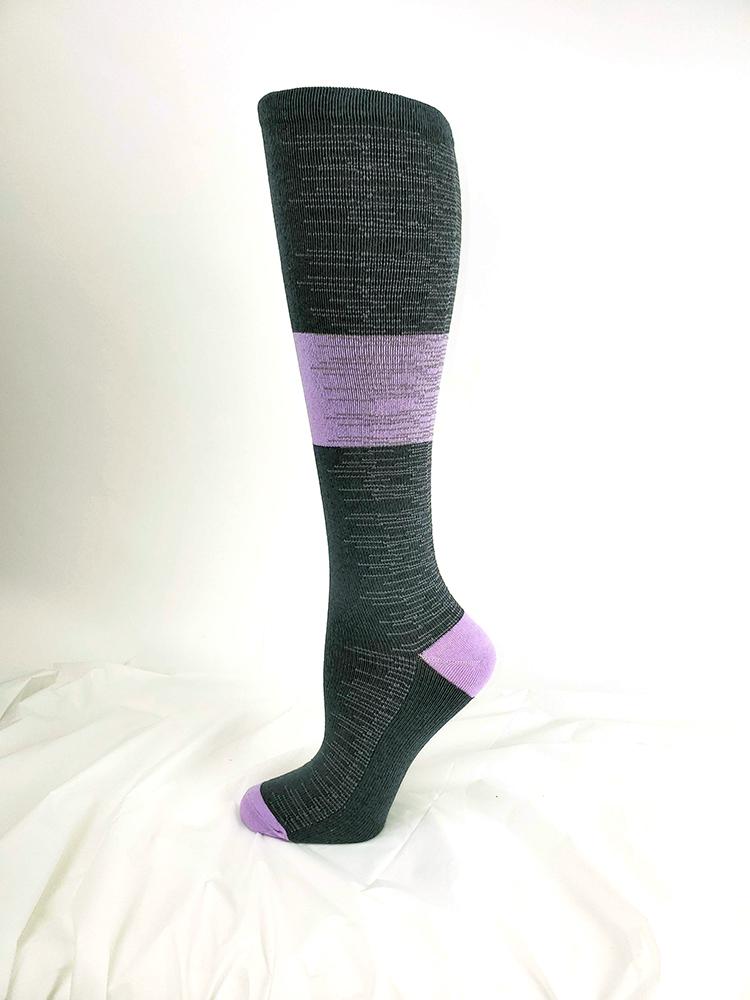 Foot mannequin displaying Pro-Motion Women's Compression Socks in pewter with orchid and white stripes