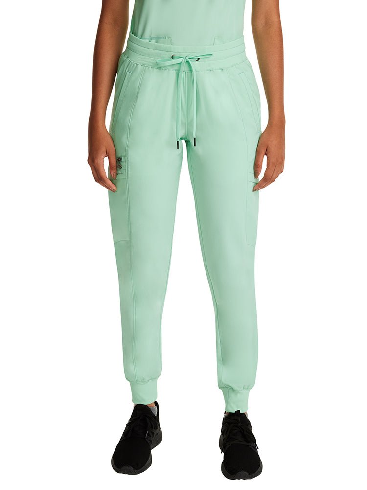 Young woman wearing a pair of Women's Toby Joggers in Cool Mint from Purple Label by Healing Hands.